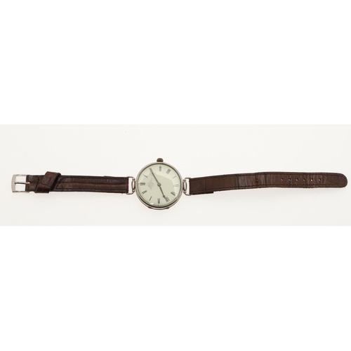 892 - A GENTLEMAN'S SILVER WRISTWATCH BY DENT. the signed circular dial with Roman numerals, on a brown le... 