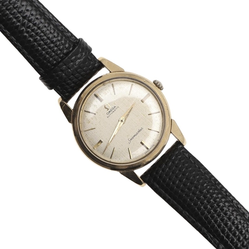 894 - A GENTLEMAN'S GOLD AUTOMATIC SEAMASTER WRISTWATCH BY OMEGA. the signed circular dial with baton nume... 