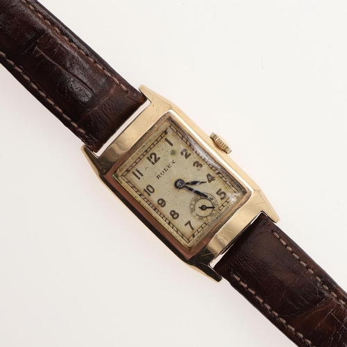 897 - A GOLD WRISTWATCH BY ROLEX. the signed rectangular-shaped dial with Arabic numerals and subsidiary s... 