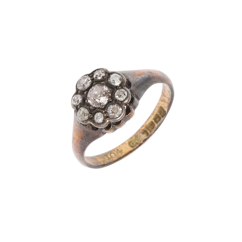 912 - A DIAMOND CLUSTER RING. mounted with circular old-cut diamonds in silver, in 18ct yellow gold mount,... 