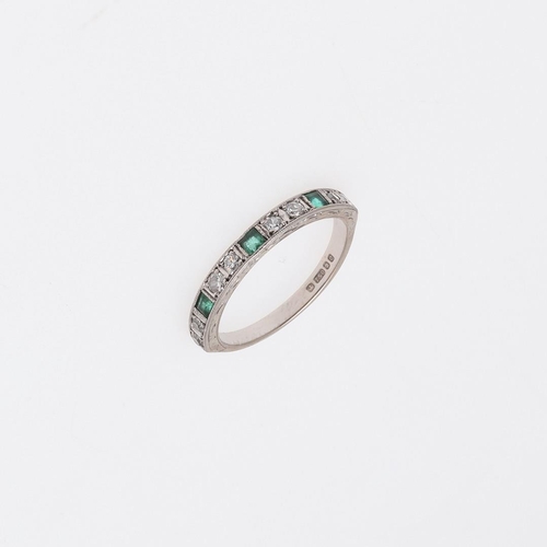 915 - AN EMERALD AND DIAMOND HALF HOOP RING. mounted with three rectangular-shaped emeralds and eight circ... 