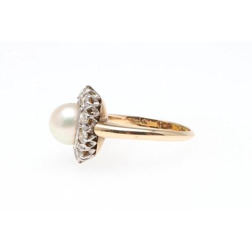 916 - A CULTURED PEARL AND DIAMOND CLUSTER RING. centred with a cultured pearl measuring approximately 7.4... 