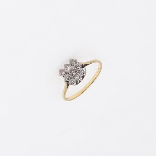 923 - A DIAMOND RING. mounted with nine circular-cut diamonds, in 18ct gold, 2.3 grams. Size M.