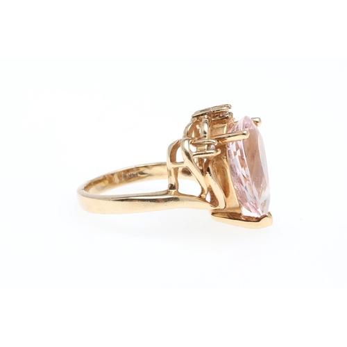 925 - A MORGANITE AND DIAMOND RING. set with a pear-shaped morganite weighing 4.40 carats, with three circ... 