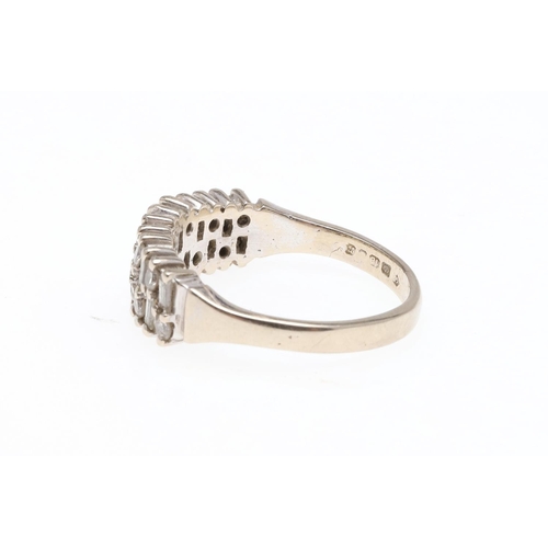 929 - A DIAMOND HALF HOOP RING. mounted with baguette-cut and circular-cut diamonds, in 18ct white gold, 5... 