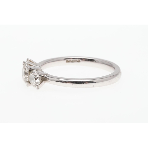 930 - A DIAMOND THREE STONE RING. mounted with three graduated brilliant-cut diamonds, in platinum, 4.5 gr... 