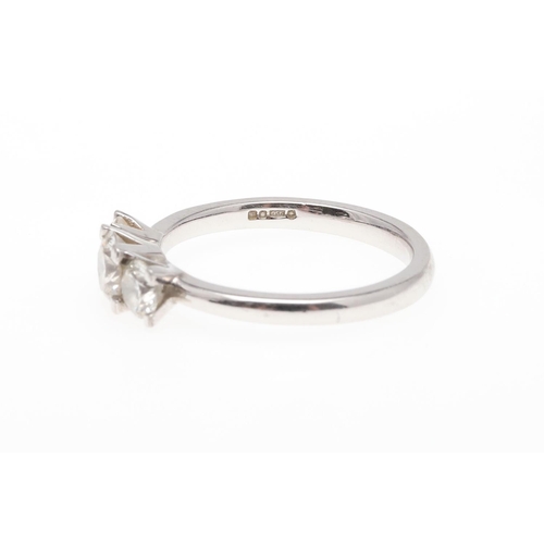 930 - A DIAMOND THREE STONE RING. mounted with three graduated brilliant-cut diamonds, in platinum, 4.5 gr... 