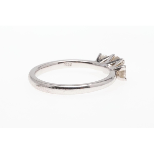 930 - A DIAMOND THREE STONE RING. mounted with three graduated brilliant-cut diamonds, in platinum, 4.5 gr... 