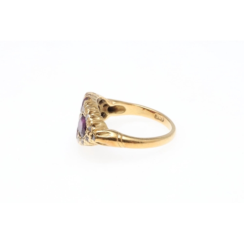 932 - A PURPLE SAPPHIRE AND DIAMOND RING. mounted with four oval-shaped purple sapphires and single-cut di... 