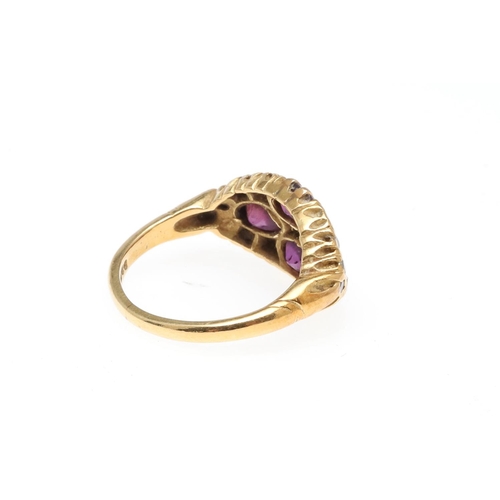 932 - A PURPLE SAPPHIRE AND DIAMOND RING. mounted with four oval-shaped purple sapphires and single-cut di... 