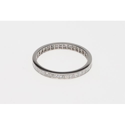 934 - A DIAMOND FULL CIRCLE ETERNITY RING. mounted with princess-cut diamonds weighing 1.05 carats in tota... 