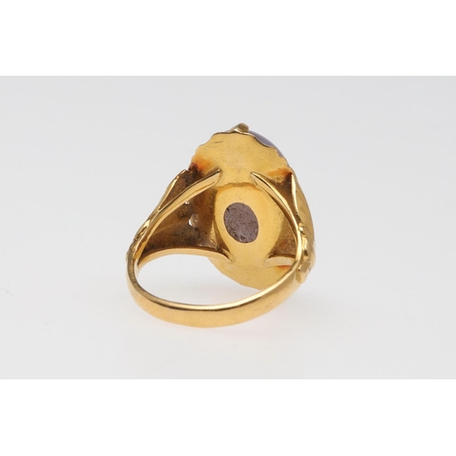 939 - A LAVENDER JADE RING. mounted with an oval-shaped jade cabochon, in gold, 5.6 grams. Size M.