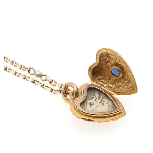 944 - A GOLD AND SAPPHIRE HEART-SHAPED LOCKET PENDANT. the locket of textured design is centred with an ov... 