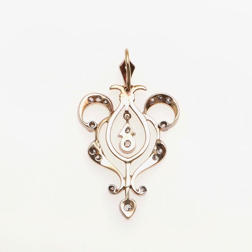 949 - A VICTORIAN DIAMOND PENDANT. the openwork scrolling mount is set with graduated old-cut diamonds, in... 