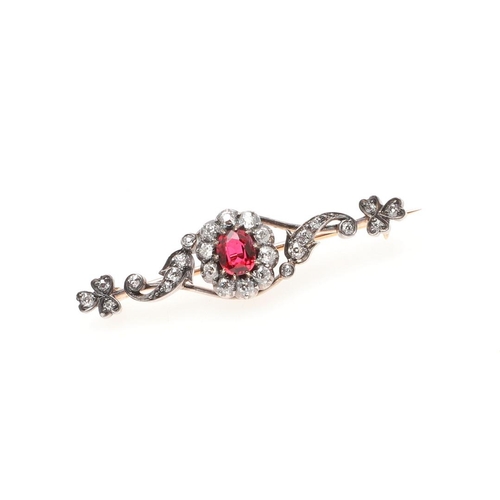 958 - A VICTORIAN DIAMOND AND SPINEL BROOCH. the oval-shaped red spinel is set within a surround of round ... 