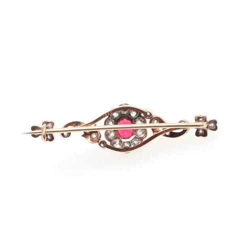 958 - A VICTORIAN DIAMOND AND SPINEL BROOCH. the oval-shaped red spinel is set within a surround of round ... 