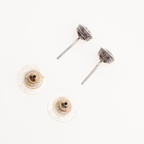 959 - A PAIR OF DIAMOND STUD EARRINGS. each earring set with brilliant-cut diamond weighing approximately ... 