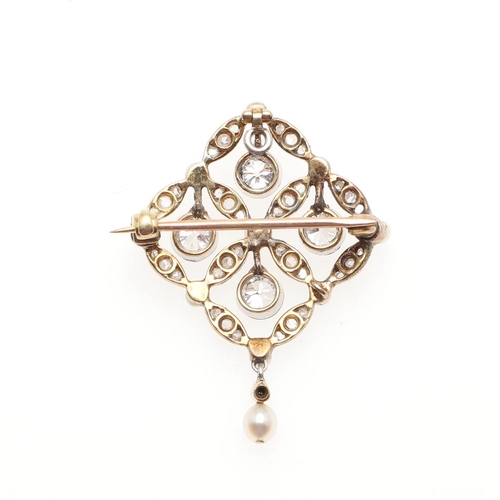 963 - AN EDWARDIAN DIAMOND AND PEARL BROOCH PENDANT. of quatrefoil foliate form, mounted with four collet ... 