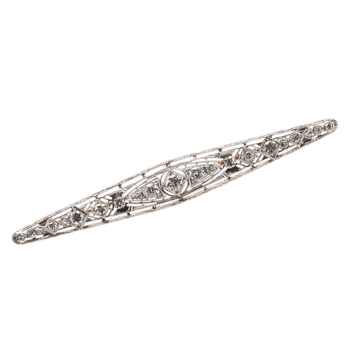 967 - A DIAMOND BAR BROOCH. of openwork design, set with graduated circular-cut diamonds, in gold, 7.3cm l... 