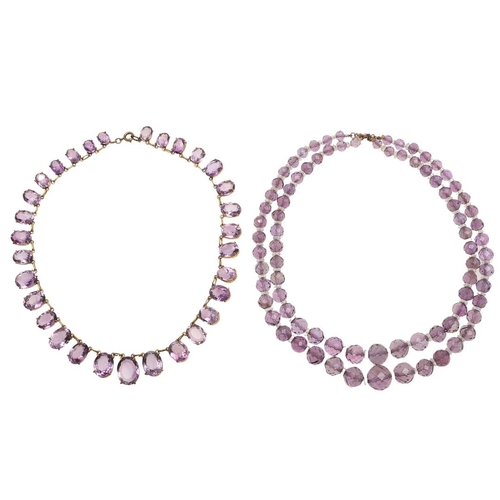 970 - AN AMETHYST NECKLACE. mounted with graduated oval-shaped amethyst drops in gilt metal, 35.5cm long, ... 