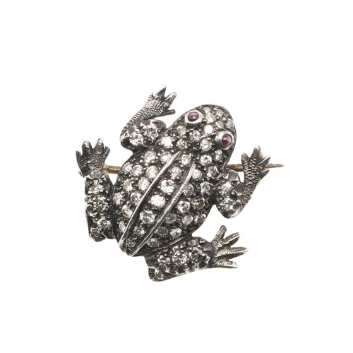 981 - A DIAMOND SET FROG BROOCH. mounted overall with circular-cut diamonds, in silver and backed in gold,... 