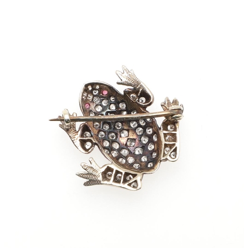 981 - A DIAMOND SET FROG BROOCH. mounted overall with circular-cut diamonds, in silver and backed in gold,... 