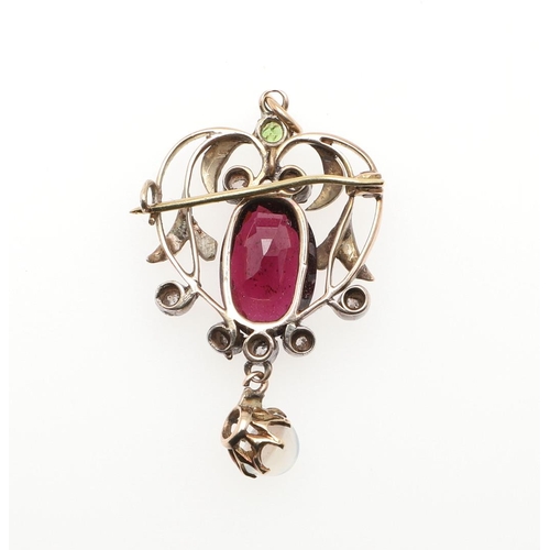 983 - A GARNET, DIAMOND AND DEMANTOID GARNET PENDANT. the gold openwork mount is centred with an oval-shap... 