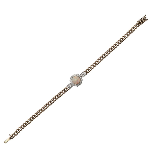 985 - AN OPAL AND DIAMOND BRACELET. the circular solid white opal is set within a surround of circular old... 