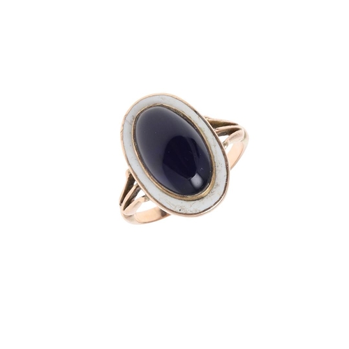 992 - A GEORGIAN ENAMEL AND PASTE SET RING. centred with an oval-shaped foil backed blue  paste stone with... 