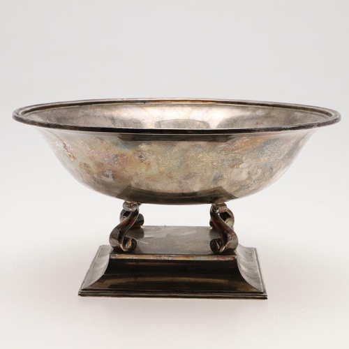 122 - A MODERN SILVER FRUIT DISH ON STAND, BY THEO FENNELL. circular form, raised on a sloping square base... 