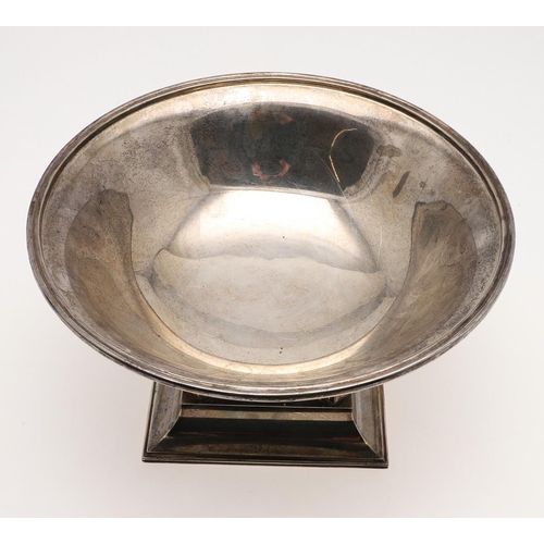 122 - A MODERN SILVER FRUIT DISH ON STAND, BY THEO FENNELL. circular form, raised on a sloping square base... 
