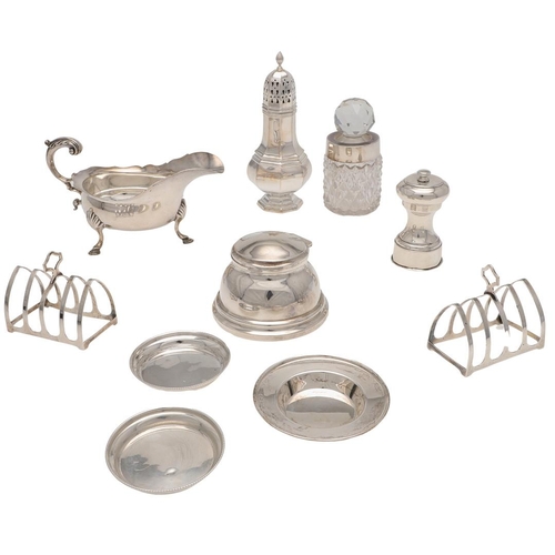 158 - A SMALL MIXED LOT OF SILVER. to include a pair of toast racks, an inkwell (loaded base), a sauce boa... 