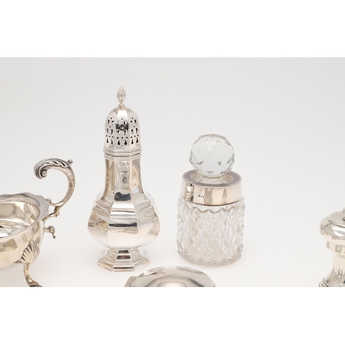 158 - A SMALL MIXED LOT OF SILVER. to include a pair of toast racks, an inkwell (loaded base), a sauce boa... 