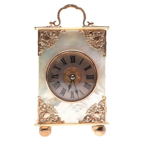 438 - A VICTORIAN MOTHER OF PEARL BOUDOIR TIMEPIECE. the dial with ornate pierced central panel and Roman ... 