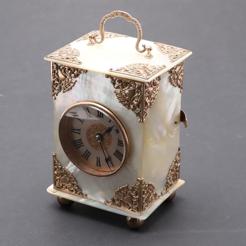 438 - A VICTORIAN MOTHER OF PEARL BOUDOIR TIMEPIECE. the dial with ornate pierced central panel and Roman ... 