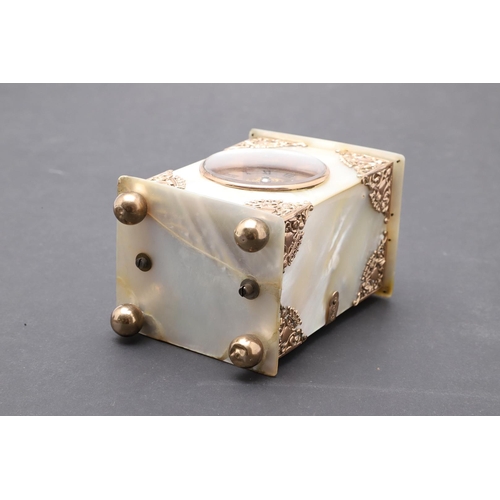 438 - A VICTORIAN MOTHER OF PEARL BOUDOIR TIMEPIECE. the dial with ornate pierced central panel and Roman ... 