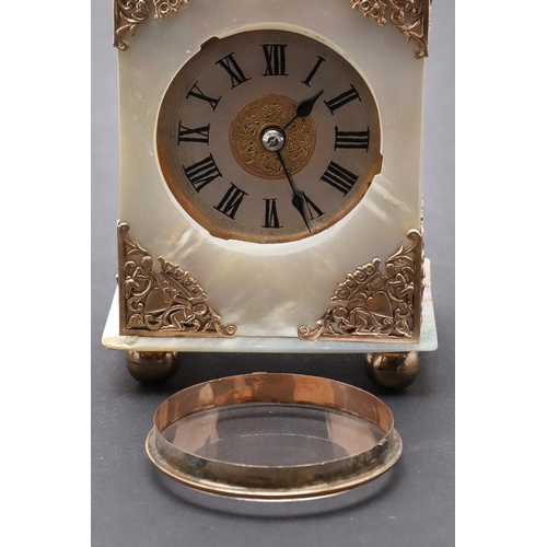 438 - A VICTORIAN MOTHER OF PEARL BOUDOIR TIMEPIECE. the dial with ornate pierced central panel and Roman ... 