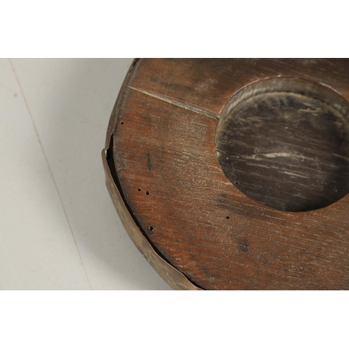 452 - A PAIR OF EARLY 19TH CENTURY BRASS BOUND OAK TAVERN COASTERS. of double gourd shape, on brass caster... 