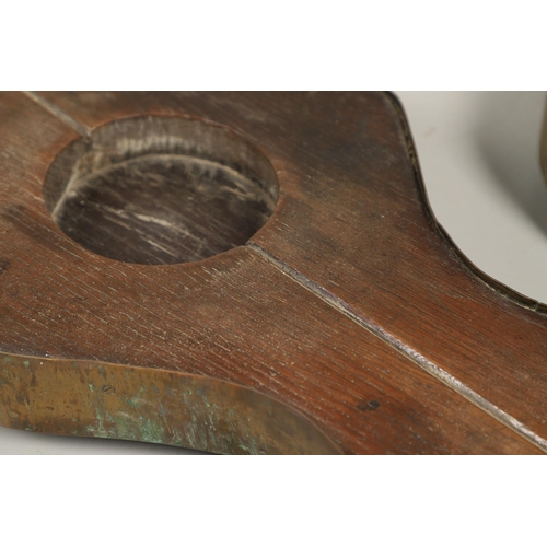 452 - A PAIR OF EARLY 19TH CENTURY BRASS BOUND OAK TAVERN COASTERS. of double gourd shape, on brass caster... 