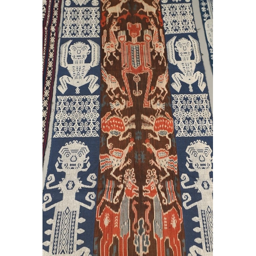 458 - FIVE INDONESIAN SUMBA IKAT COTTON TEXTILE PANELS. of varying size and design, the longest 243cm x 66... 