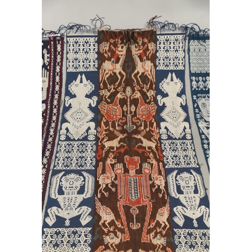 458 - FIVE INDONESIAN SUMBA IKAT COTTON TEXTILE PANELS. of varying size and design, the longest 243cm x 66... 