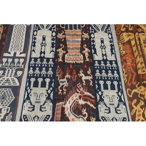 460 - FOUR INDONESIAN SUMBA IKAT COTTON TEXTILE PANELS. of varying sizes and figural designs, the longest ... 