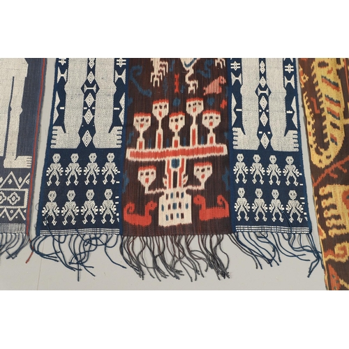 460 - FOUR INDONESIAN SUMBA IKAT COTTON TEXTILE PANELS. of varying sizes and figural designs, the longest ... 