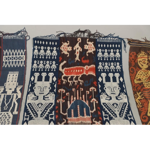 460 - FOUR INDONESIAN SUMBA IKAT COTTON TEXTILE PANELS. of varying sizes and figural designs, the longest ... 