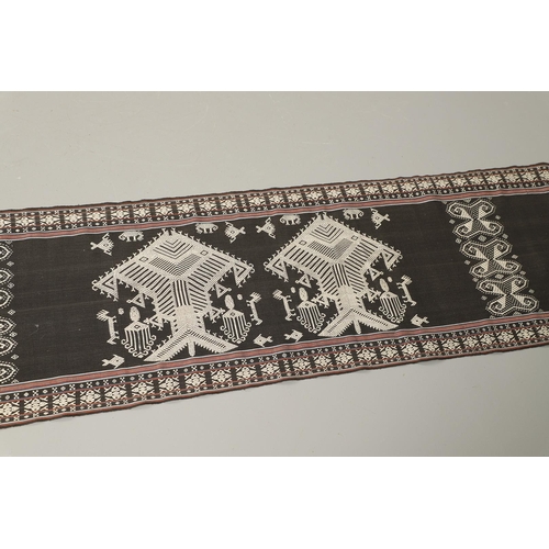 461 - AN INDONESIAN IKAT BODY ARMOUR TEXTILE. of exceptionally long length, depicting cream embroidered fi... 