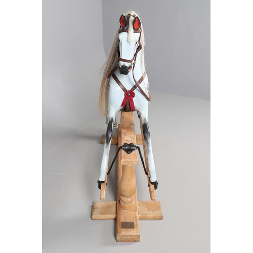 469 - A STEVENSON BROTHERS DAPPLE GREY ROCKING HORSE. with burgundy leather tack on a beech frame, with ma... 