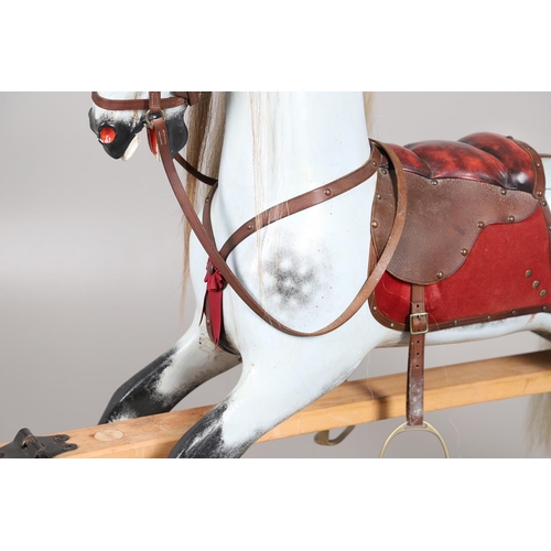 469 - A STEVENSON BROTHERS DAPPLE GREY ROCKING HORSE. with burgundy leather tack on a beech frame, with ma... 