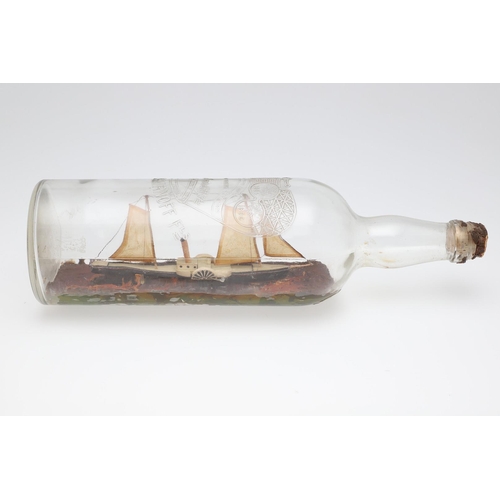 473 - A FOLK ART PADDLE STEAMER IN BOTTLE. on a painted naturalistic sea, bottle length 47cm.   *CR  No re... 