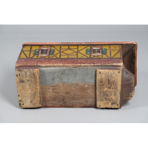 475 - A FOLK ART POLYCHROME PAINTED DOG KENNEL. circa 1900, in the form of a brick and cob barn with appli... 