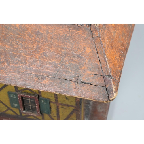 475 - A FOLK ART POLYCHROME PAINTED DOG KENNEL. circa 1900, in the form of a brick and cob barn with appli... 